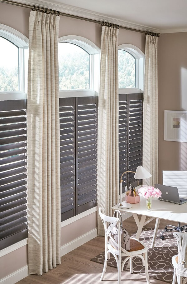 When layering window treatments, try to pair hard window treatments, like shutters and blinds, with soft window treatments.