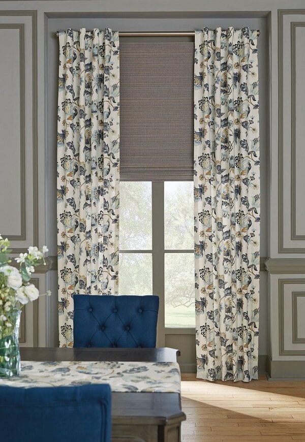 Pick a pattern or print to layer on top of a solid colored window treatment to make your windows pop.