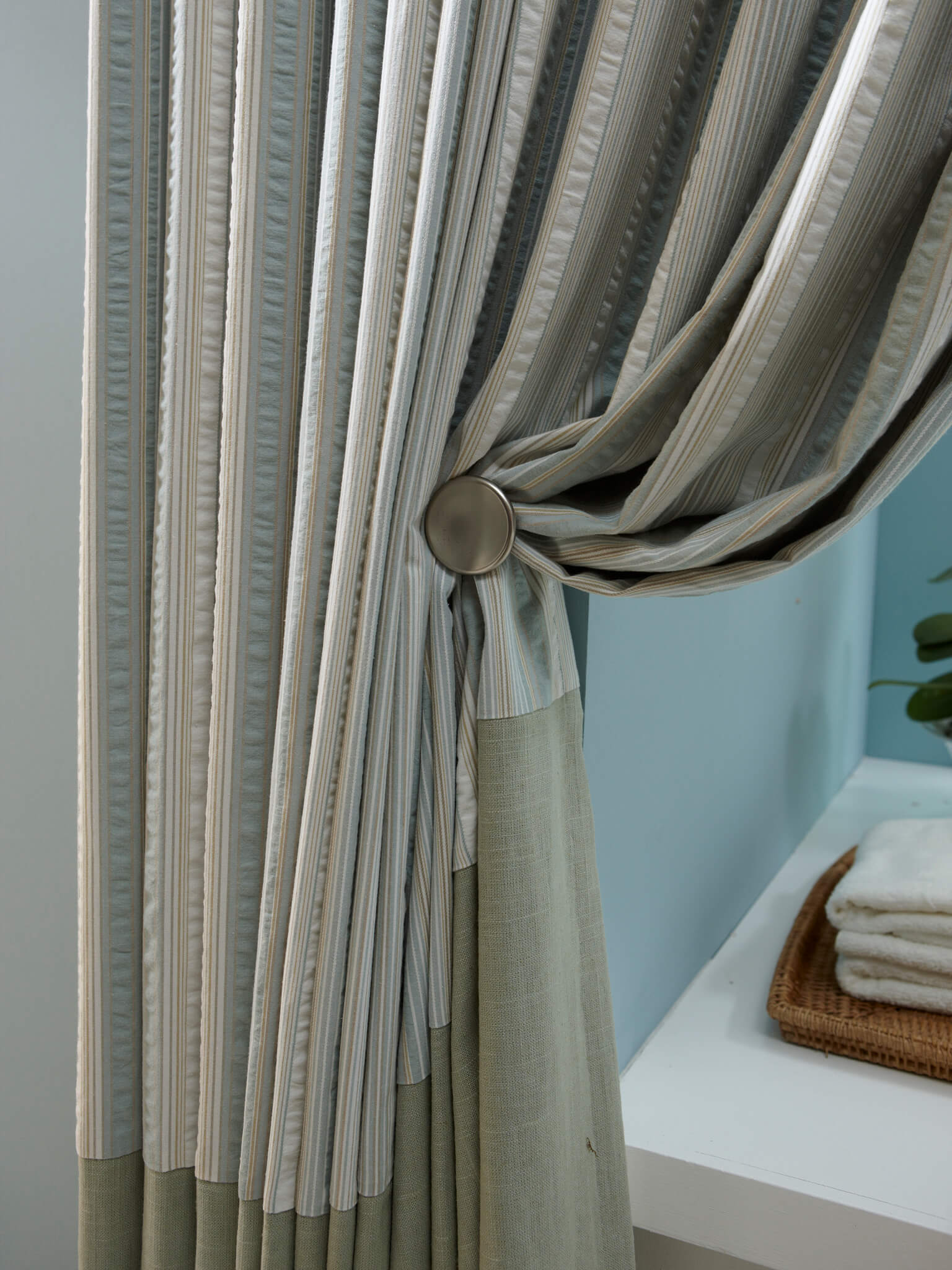 Tie backs are accessories used to hold back the curtain or drape on either side of the window. 